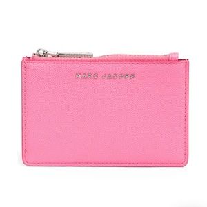 A Marc Jacobs compact wallet with a couple of card slots.